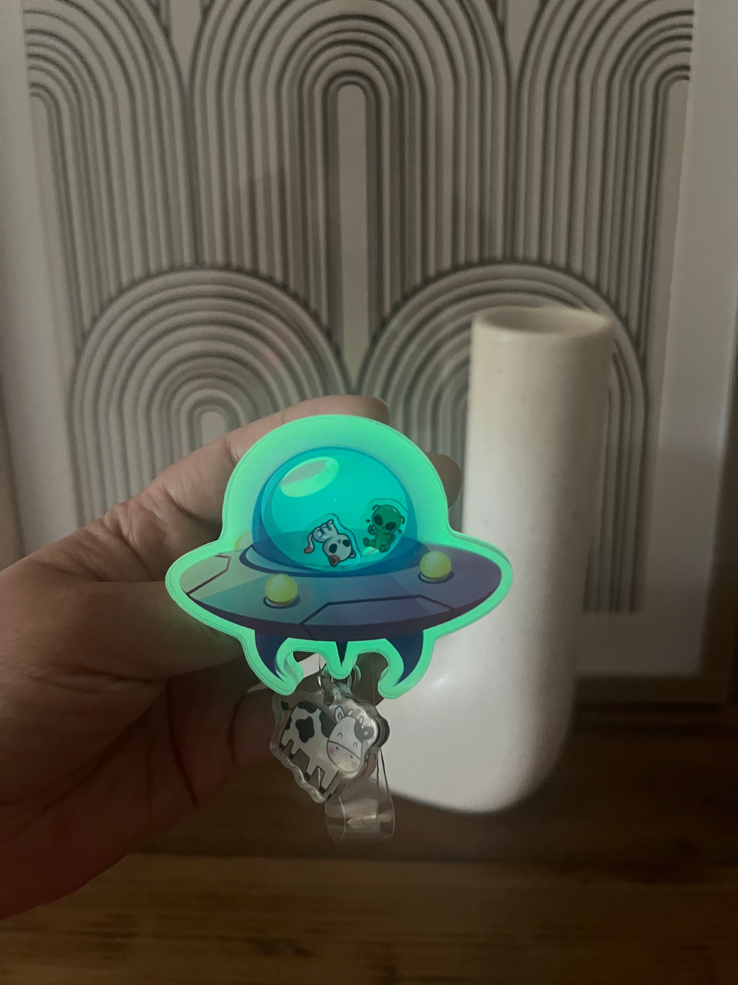 UFO badge reel: cow abduction, glows in the dark, nurse,