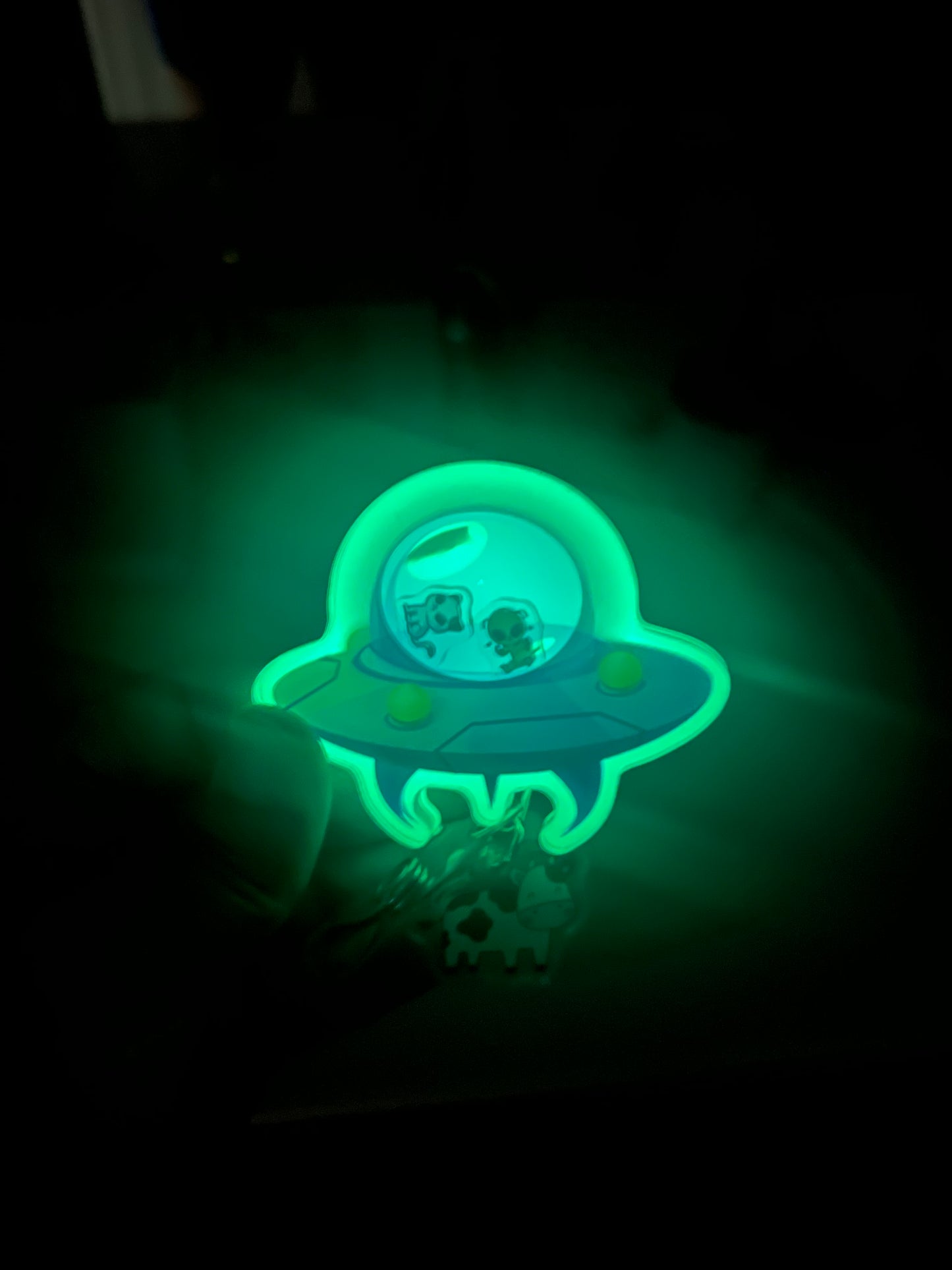 UFO badge reel: cow abduction, glows in the dark, nurse,