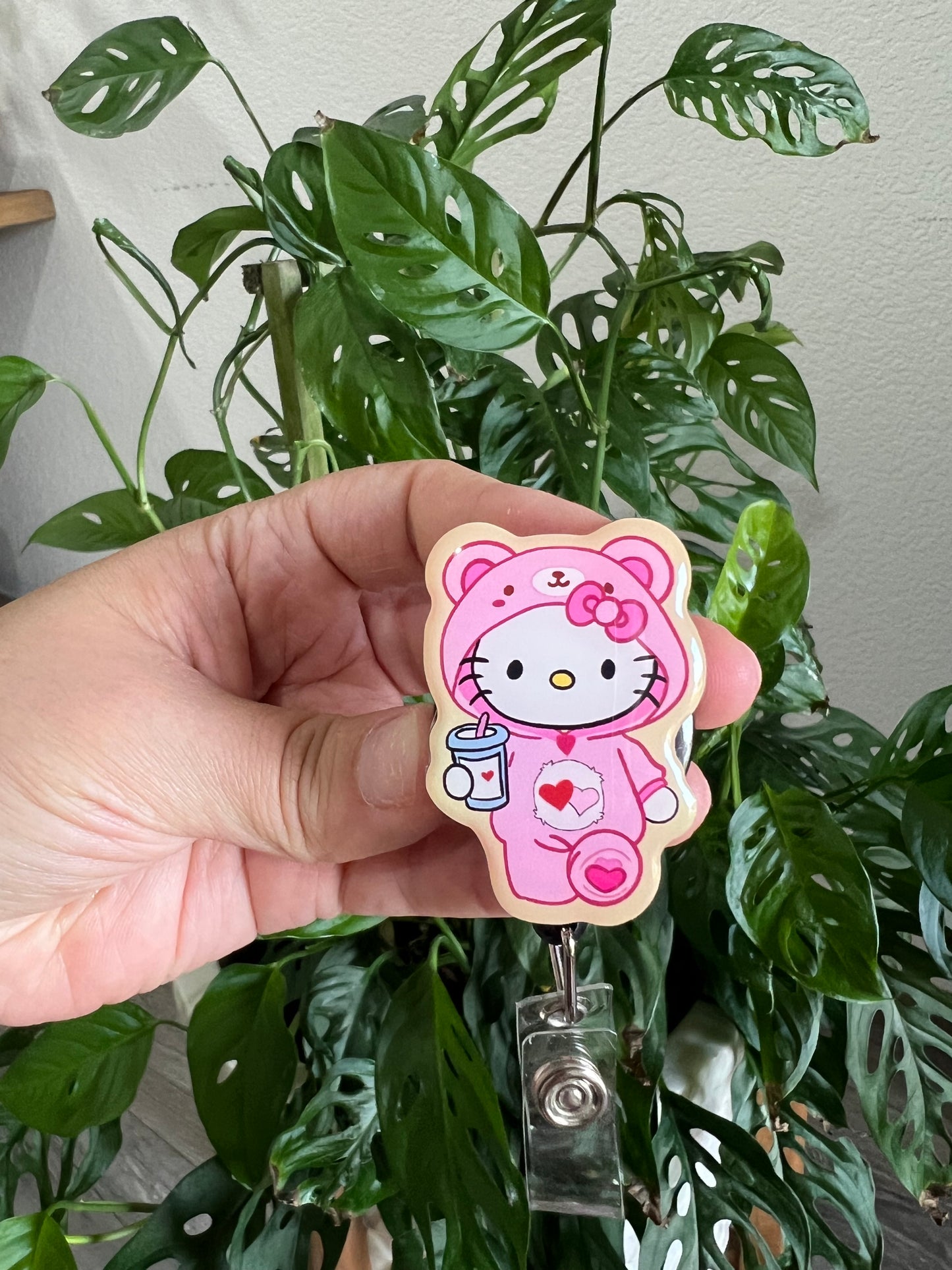 Badge Reel: hello kitty teddy bear