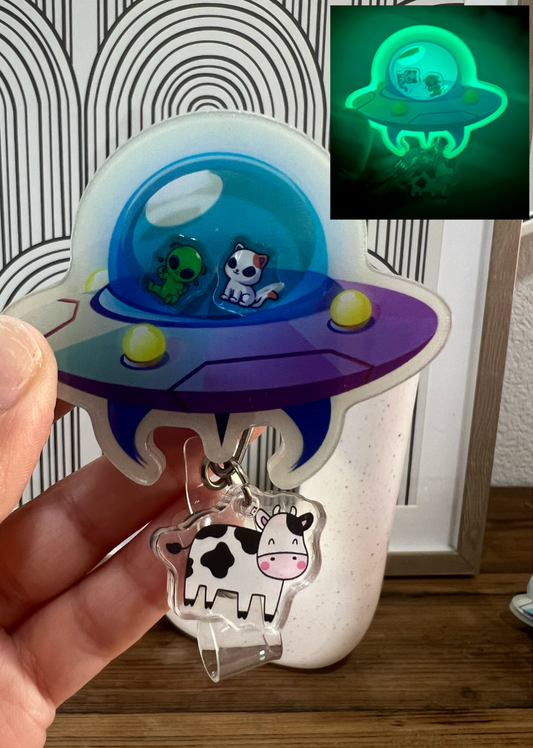 UFO badge reel: cow abduction, glows in the dark, nurse,